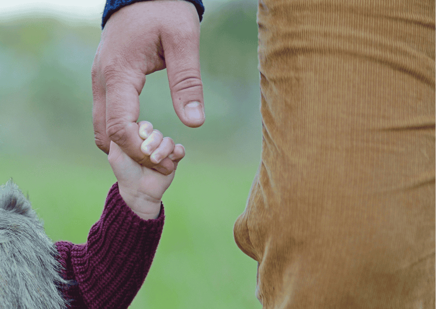 male nanny manny holding a hand in los angeles.png